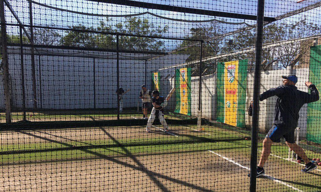 New Zealand cricketers warming up before what should have been the start of Day 5. Note the wintry conditions and torrential rain